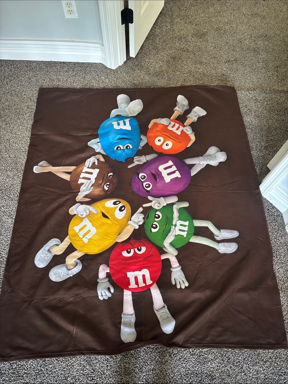 M&M's Character Throw Blanket - Multicolor Chocolate Brown Background